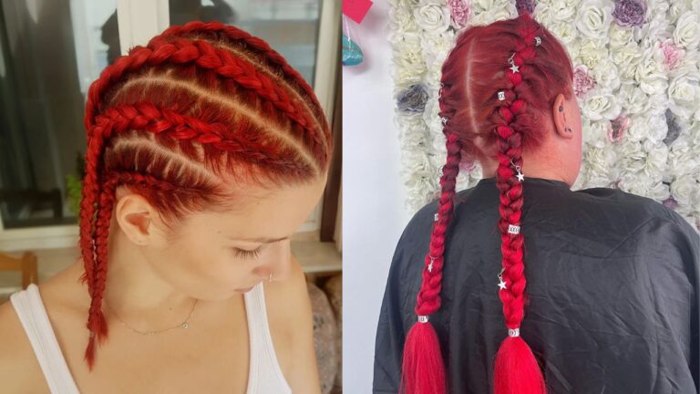 Bright red braided hairstyle with neat cornrows on top flowing into two long thick braids decorated with beads and accessories.