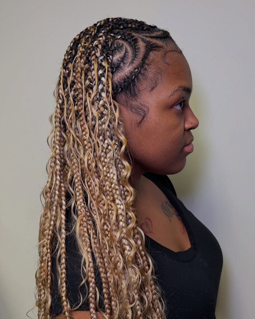 Blonde and light brown braids with loose waves creating a soft textured finish.