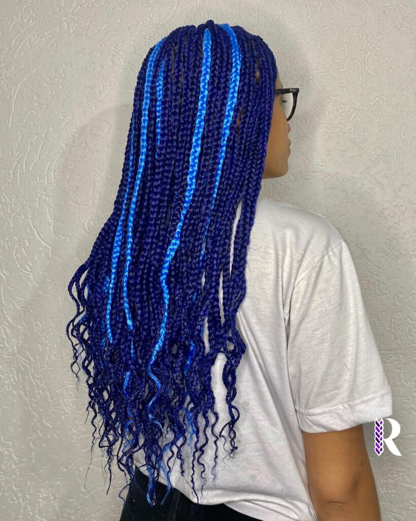 Long box braids with bright blue streaks woven through a darker blue base.