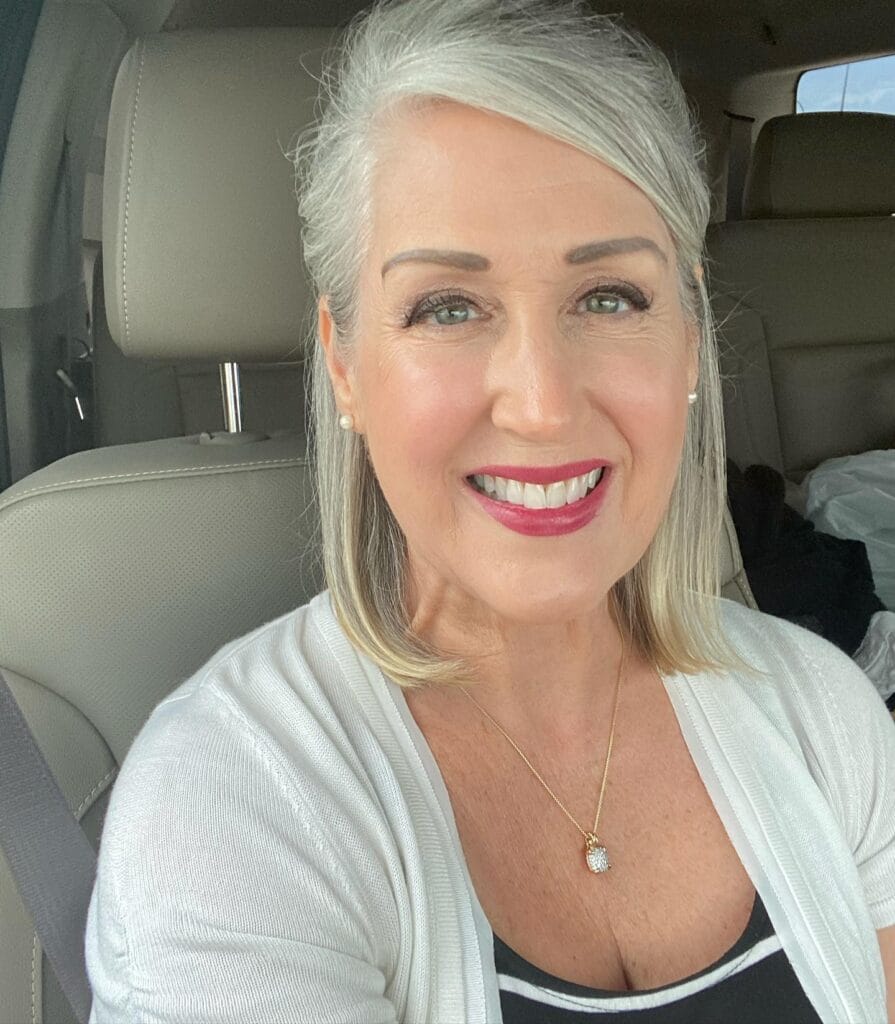 Silver long bob with straight texture and soft side bangs.