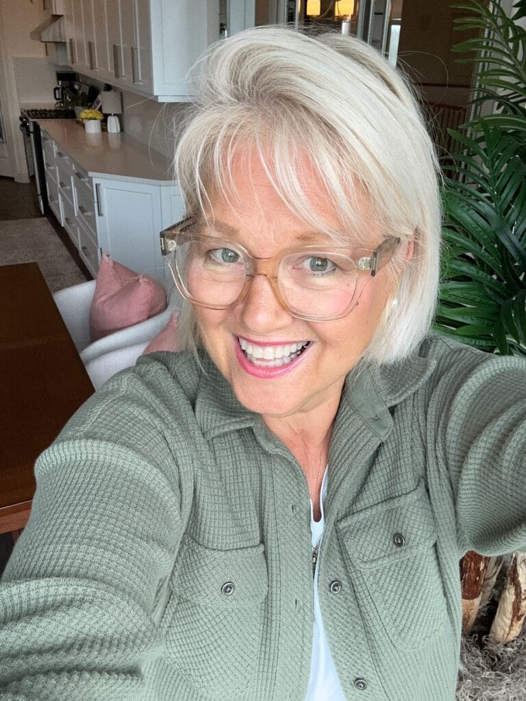 White layered bob with a wispy fringe and soft texture.