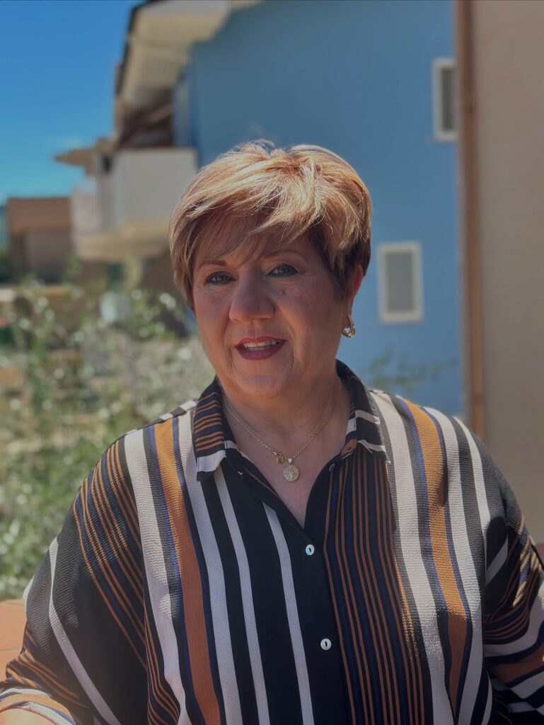 Short layered pixie haircut with a soft side swept front.