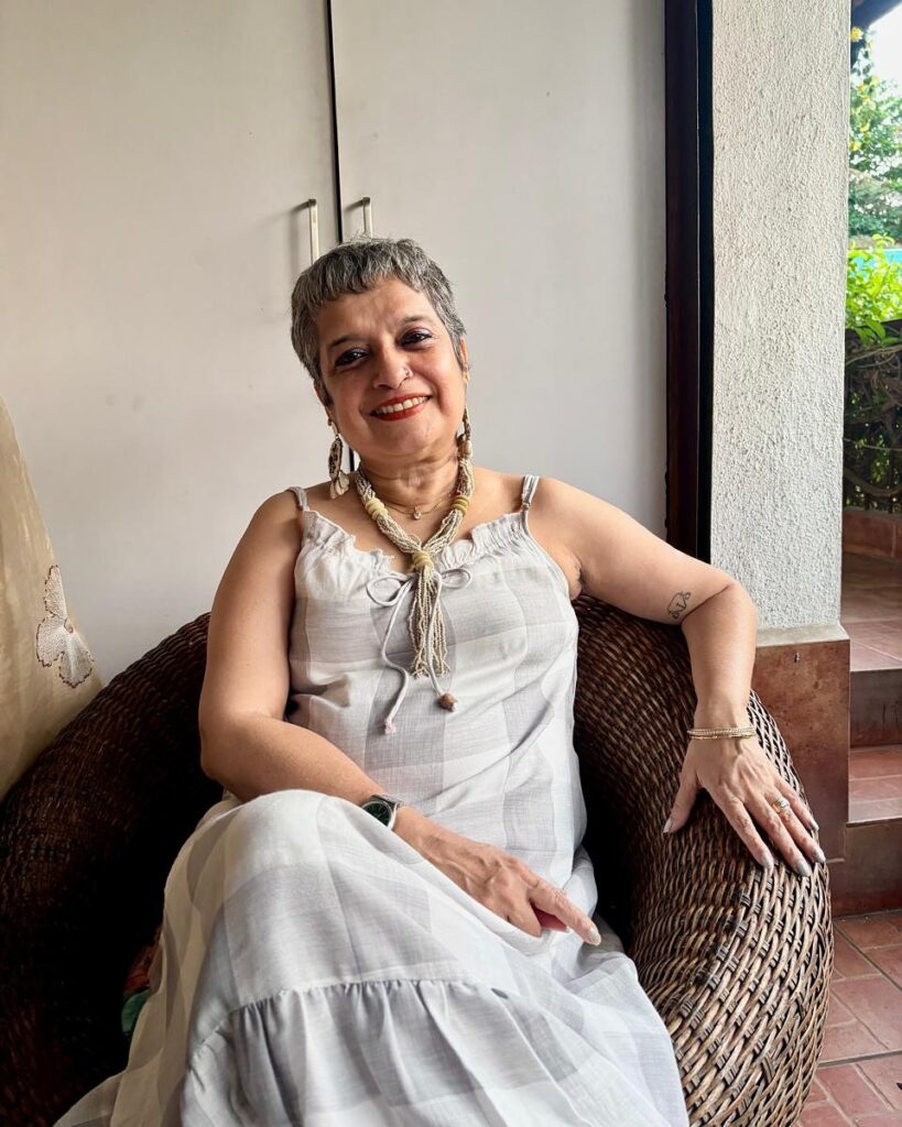 Short gray cropped hairstyle with natural texture and a soft, relaxed shape.