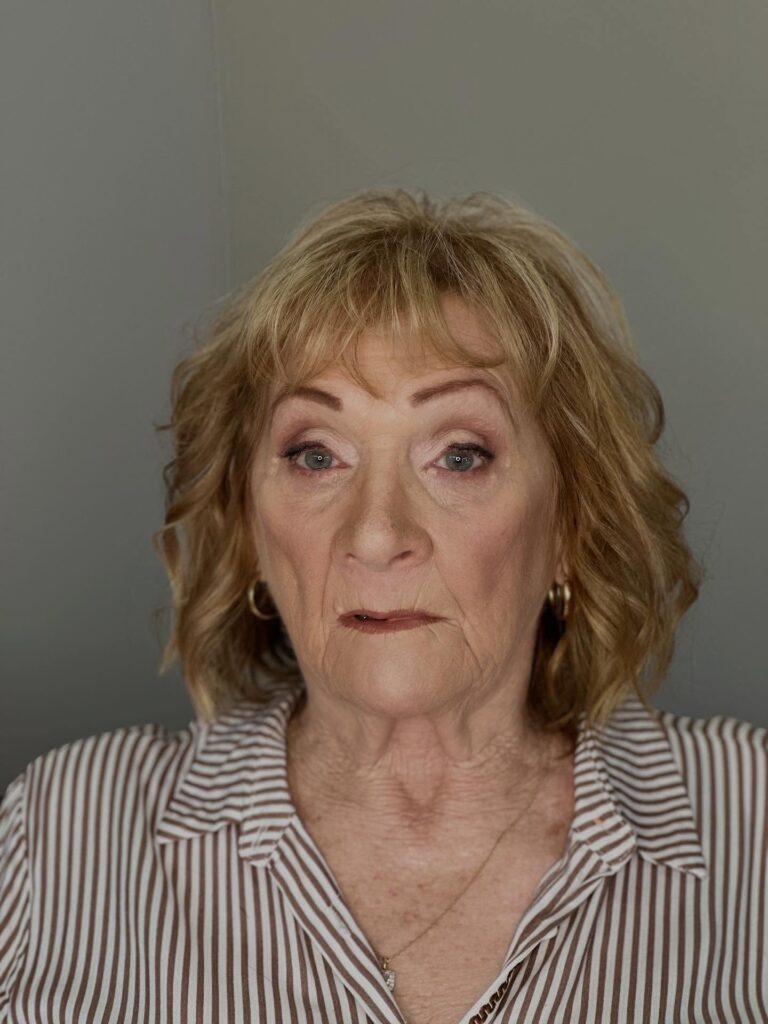 Shoulder length layered hairstyle with soft texture and gently curved ends.