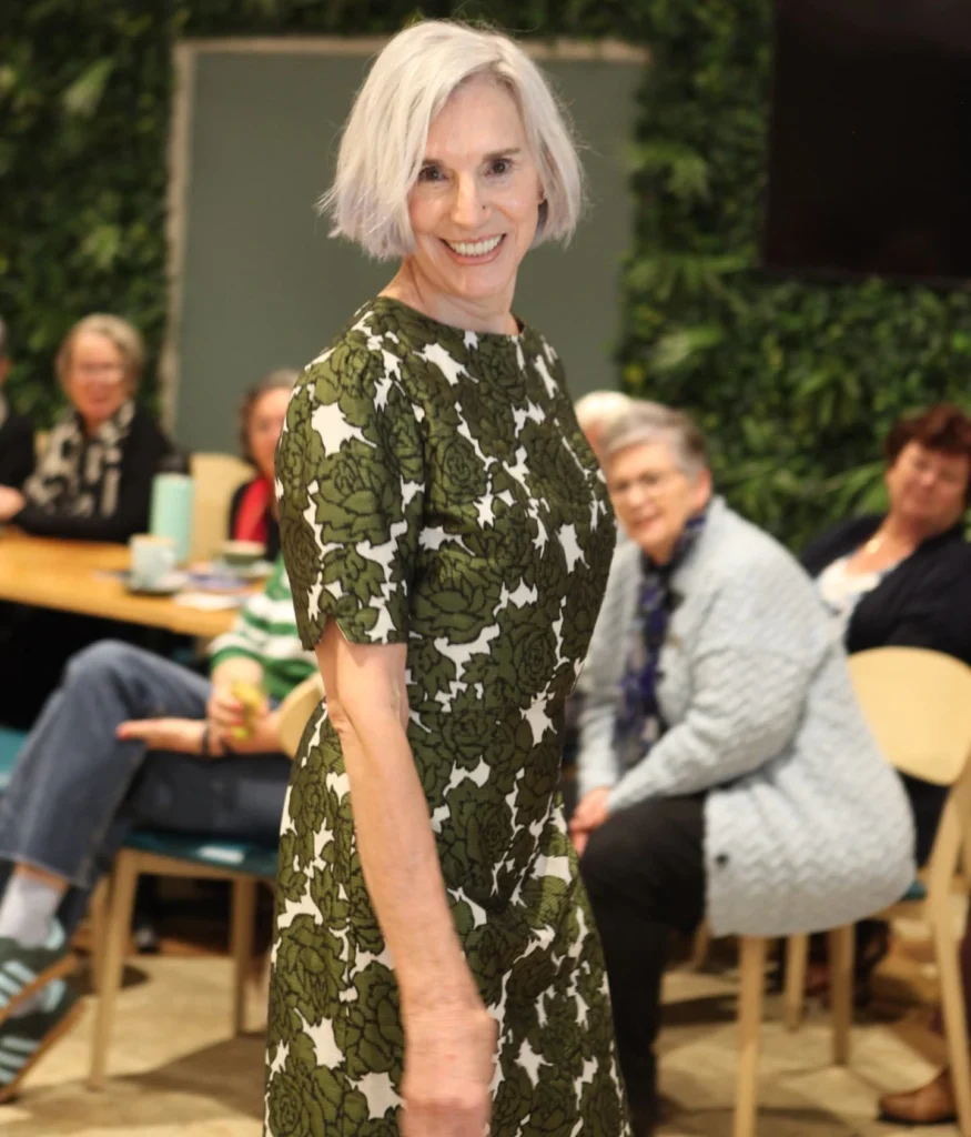 A woman with straight platinum blonde hair in a chin length bob with a soft side part.