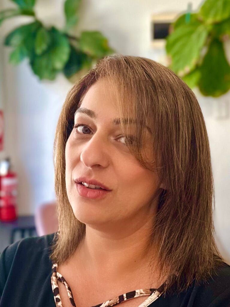 Shoulder length brown layered hairstyle with soft natural movement.