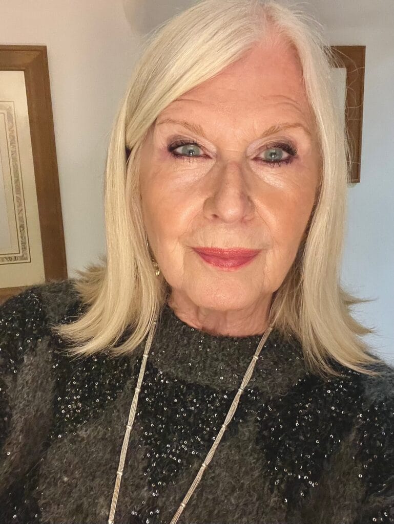 Shoulder length blonde bob with smooth texture and softly curved ends.