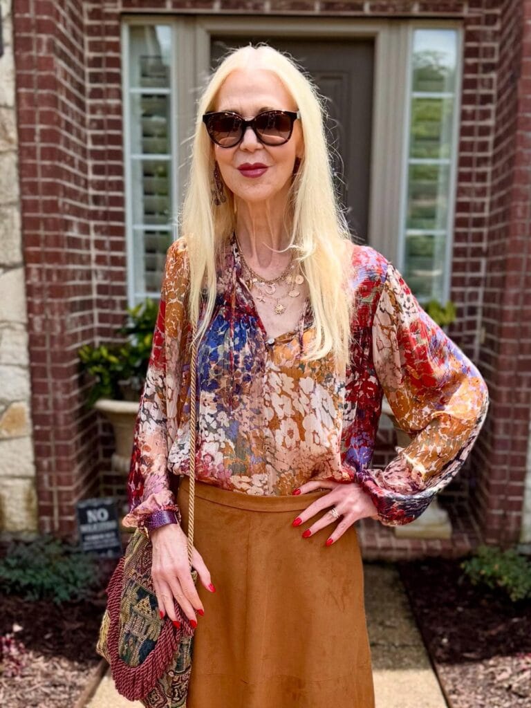 Long straight blonde hairstyle with smooth texture and clean finish.