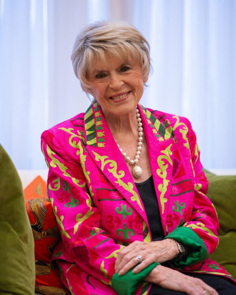 Short layered pixie with volume at the crown and softly tapered sides in a blonde tone.