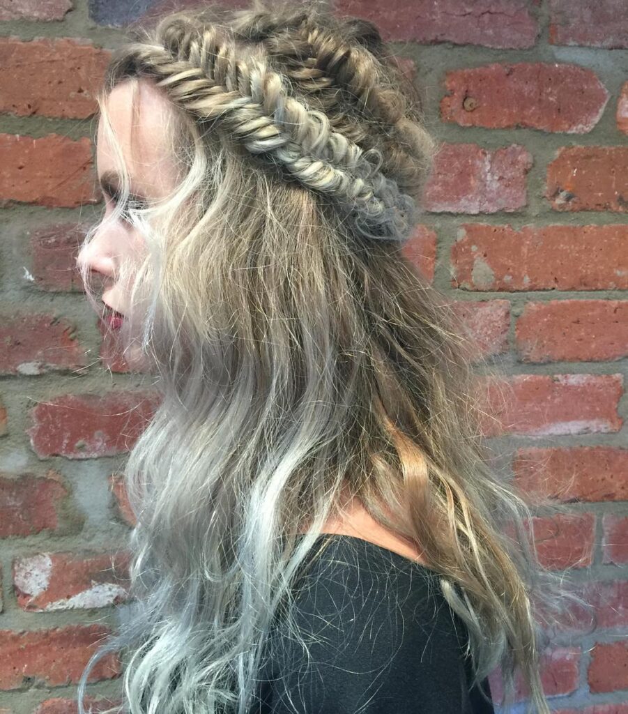 Cool blonde wavy hair with multiple loose crown braids around the head.
