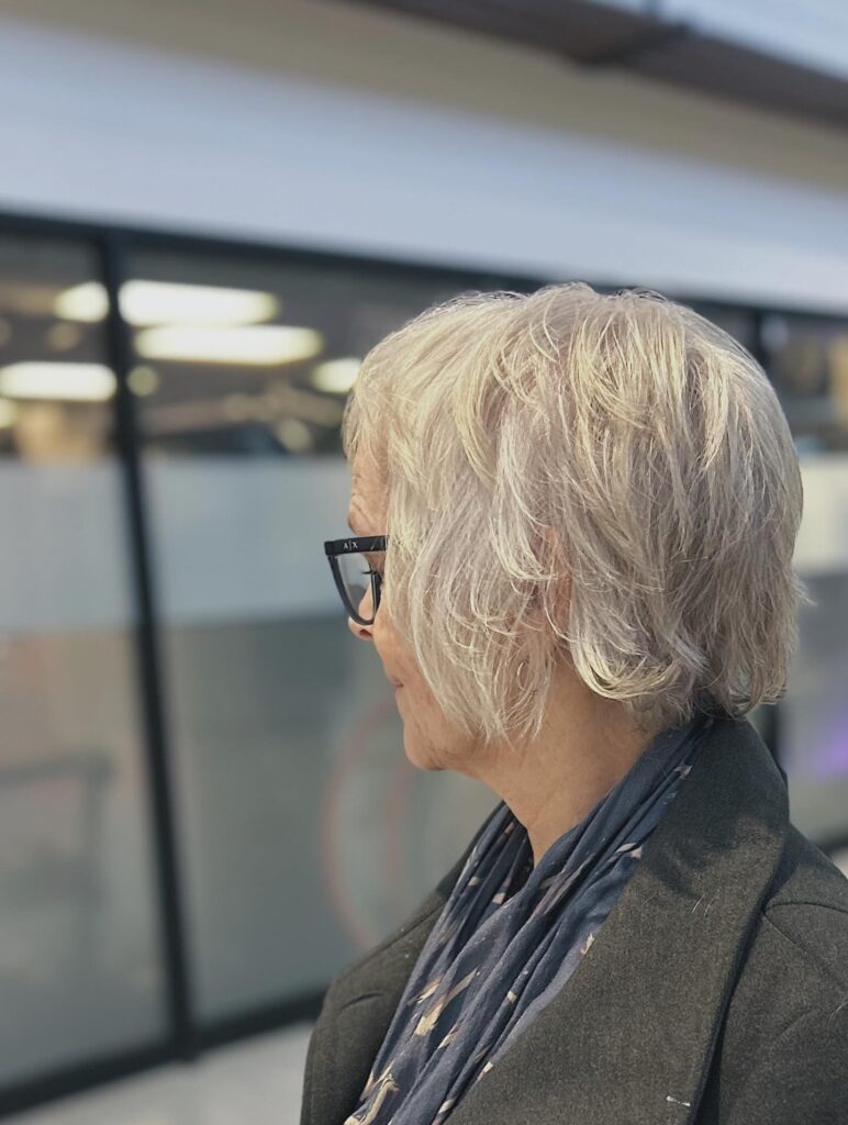 A silver layered bob with wispy textured ends and soft movement.