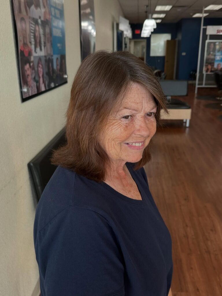 Mid-length brunette bob with soft layers and lightly textured ends.