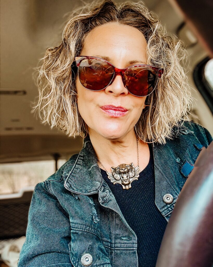 A tousled blonde shaggy bob with beachy waves and textured layered ends.