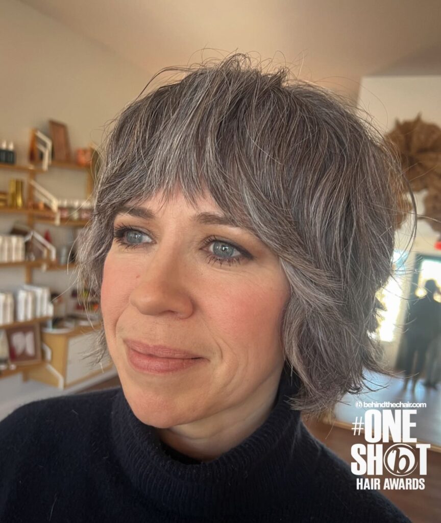 Short smoky gray shaggy bob with wispy bangs and soft layered texture.