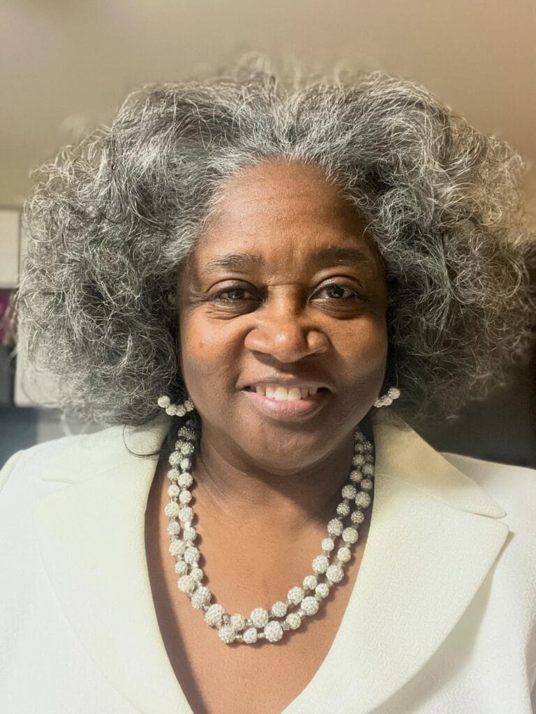 Rounded gray curly hairstyle with soft fluffy texture and natural volume.