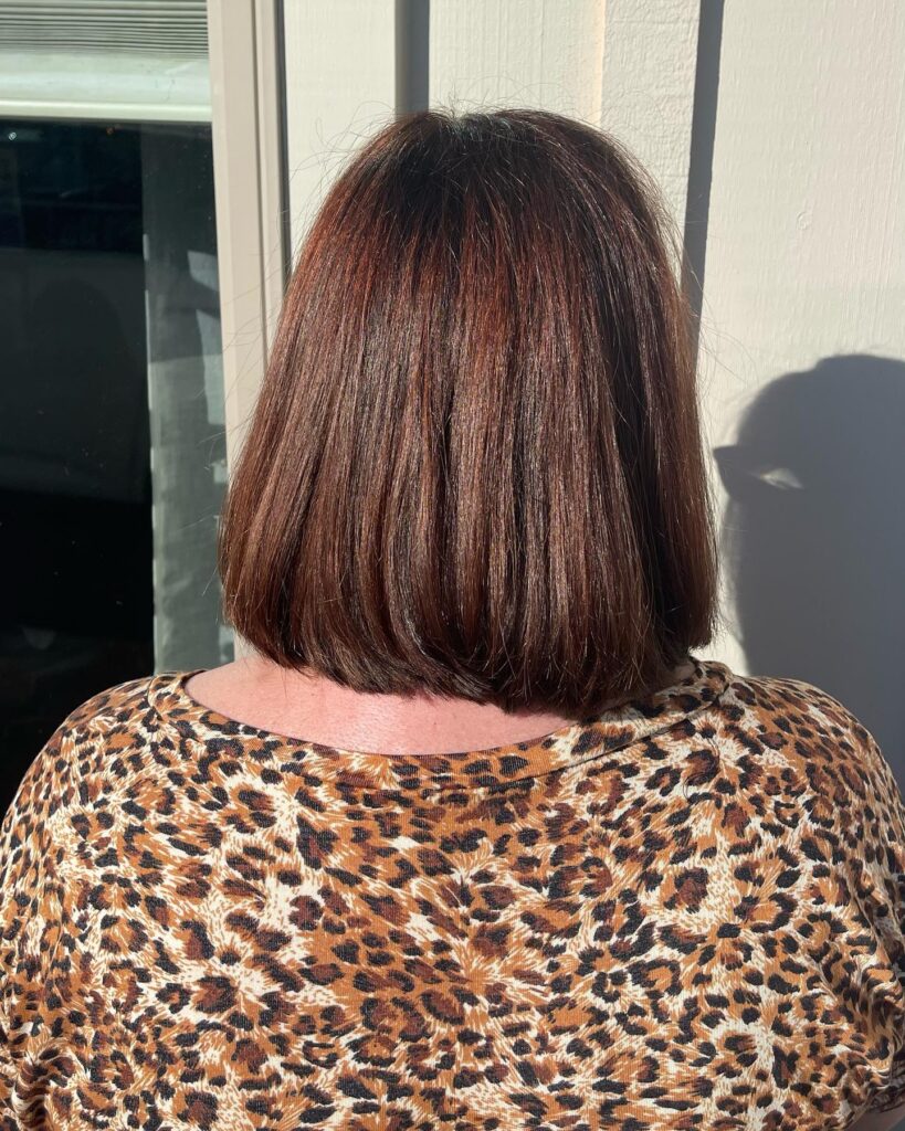 Straight chocolate brown bob with rounded ends and glossy shine.
