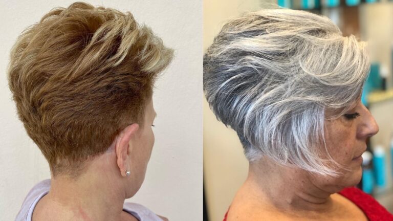 Short layered pixie haircut with stacked volume at the crown and tapered sides in warm auburn and silver tones.