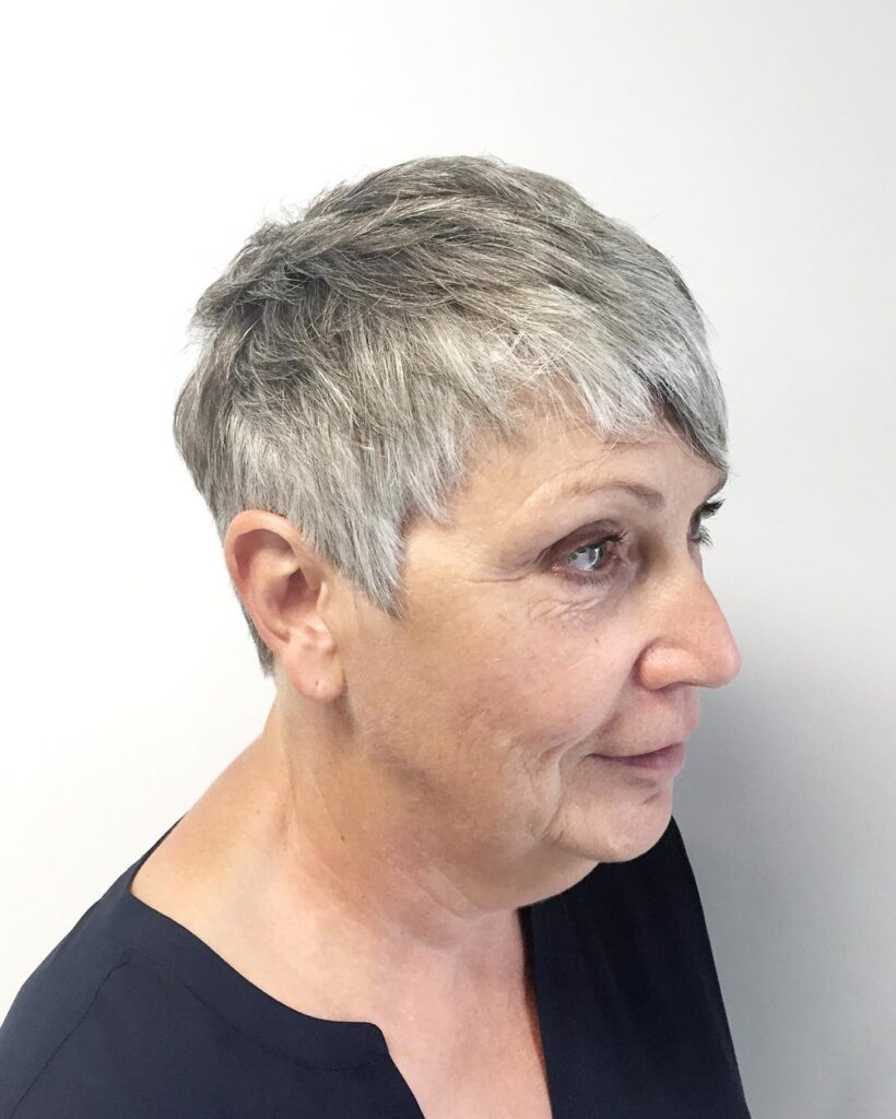 Short gray pixie haircut with soft layers and natural texture.