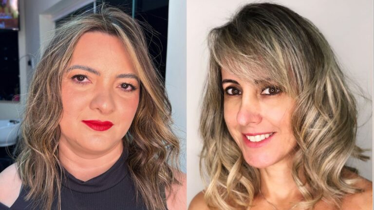 Shoulder length wavy lob with soft layers, side swept bangs, and blended blonde highlights creating a textured, voluminous look.