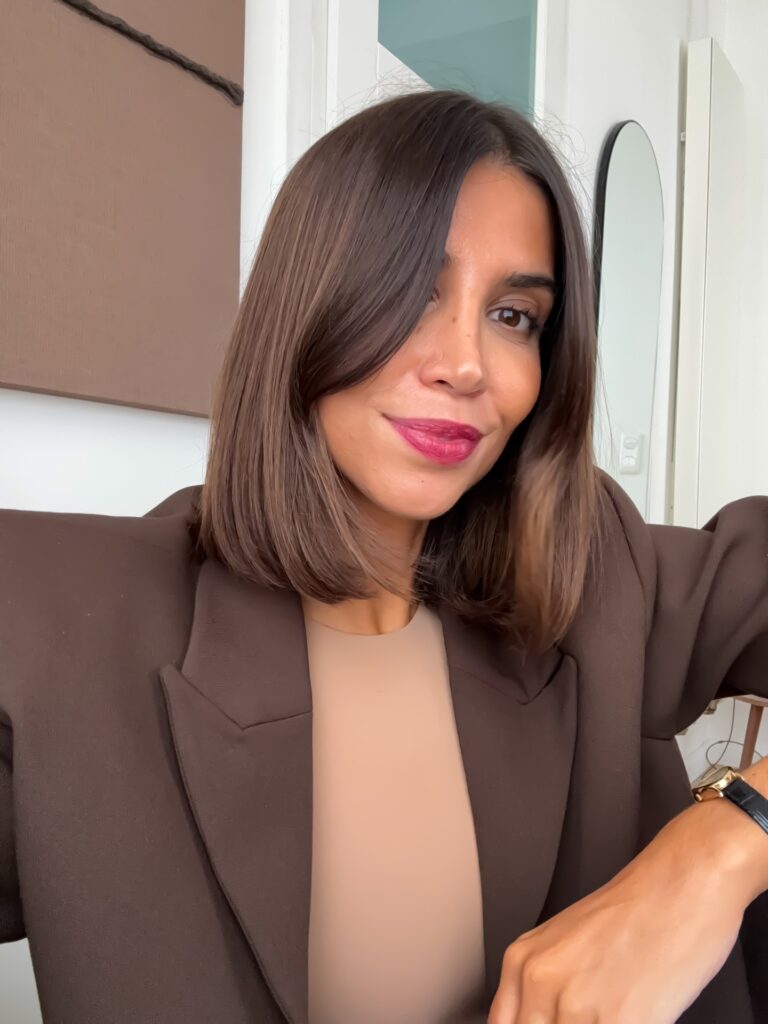 A straight long bob with a deep side part and rich brown color.