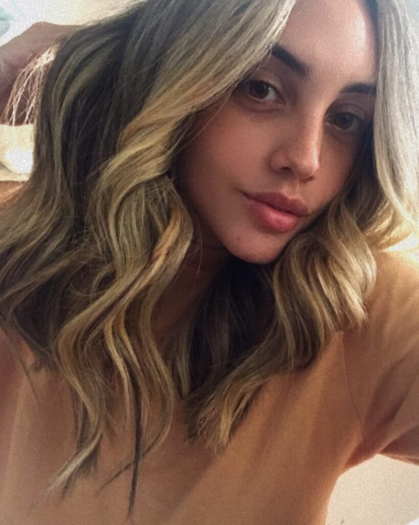 Textured lob with loose waves and soft sun kissed highlights.