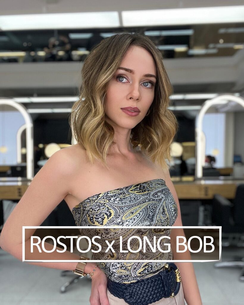 Wavy long bob with soft balayage highlights and a natural textured finish.