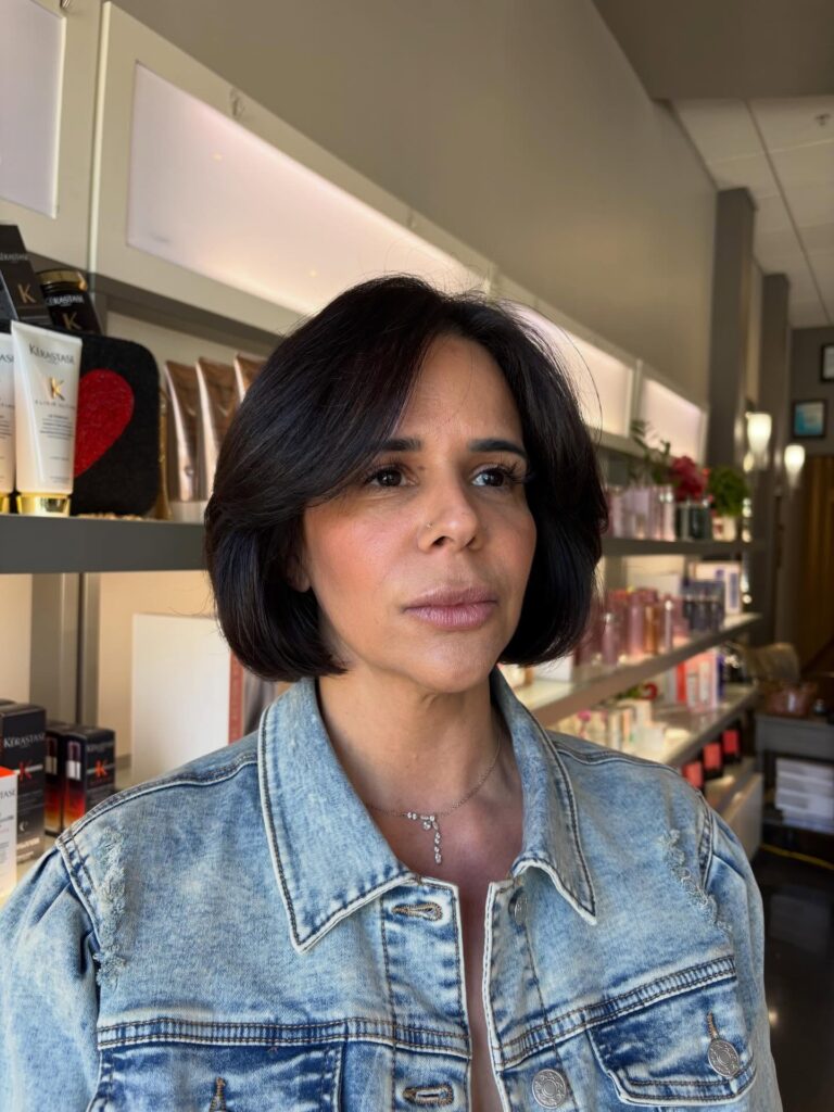 Dark espresso layered bob with a rounded shape and sleek tucked-under ends.