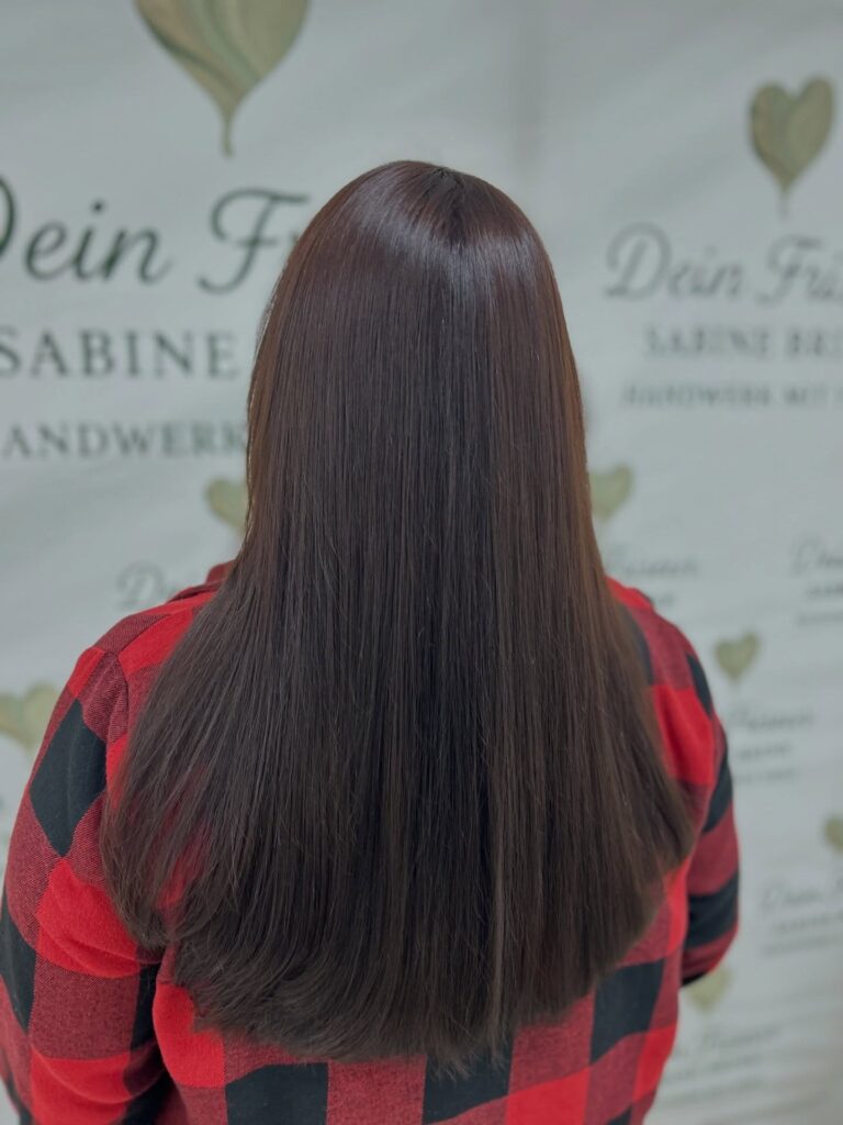 Long straight dark hair with a sleek finish and blunt ends.
