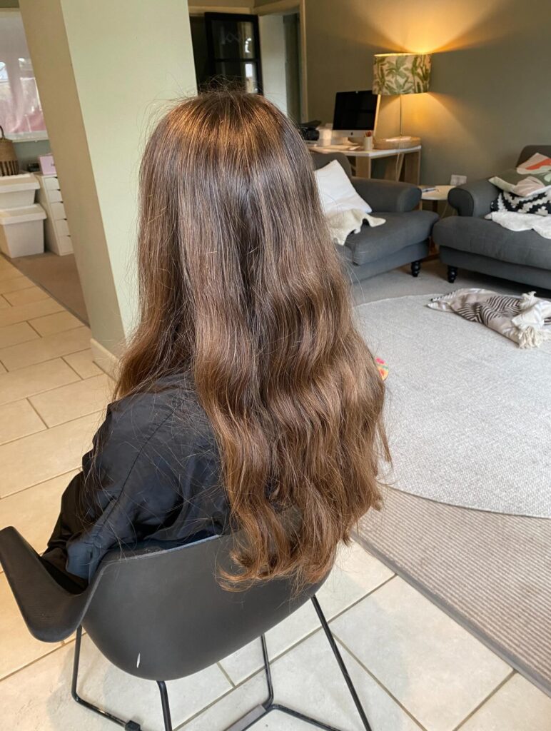 Long brown hair with soft natural waves and relaxed texture.