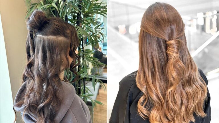Long wavy hair styled in a half up look with a small top bun and a twisted section at the back.