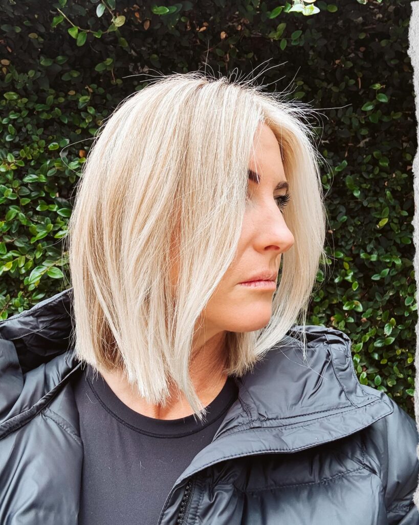 Blonde shoulder length blunt lob with sleek straight strands and clean edges.