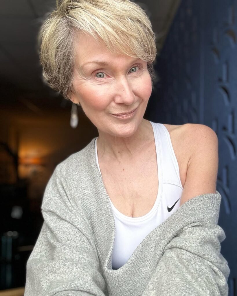Short blonde textured crop with a soft wispy fringe.