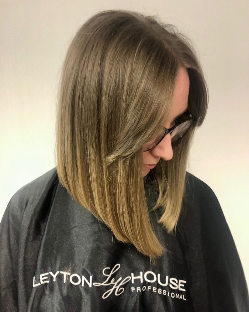 Shoulder length blunt lob with sleek straight finish and minimal layers.