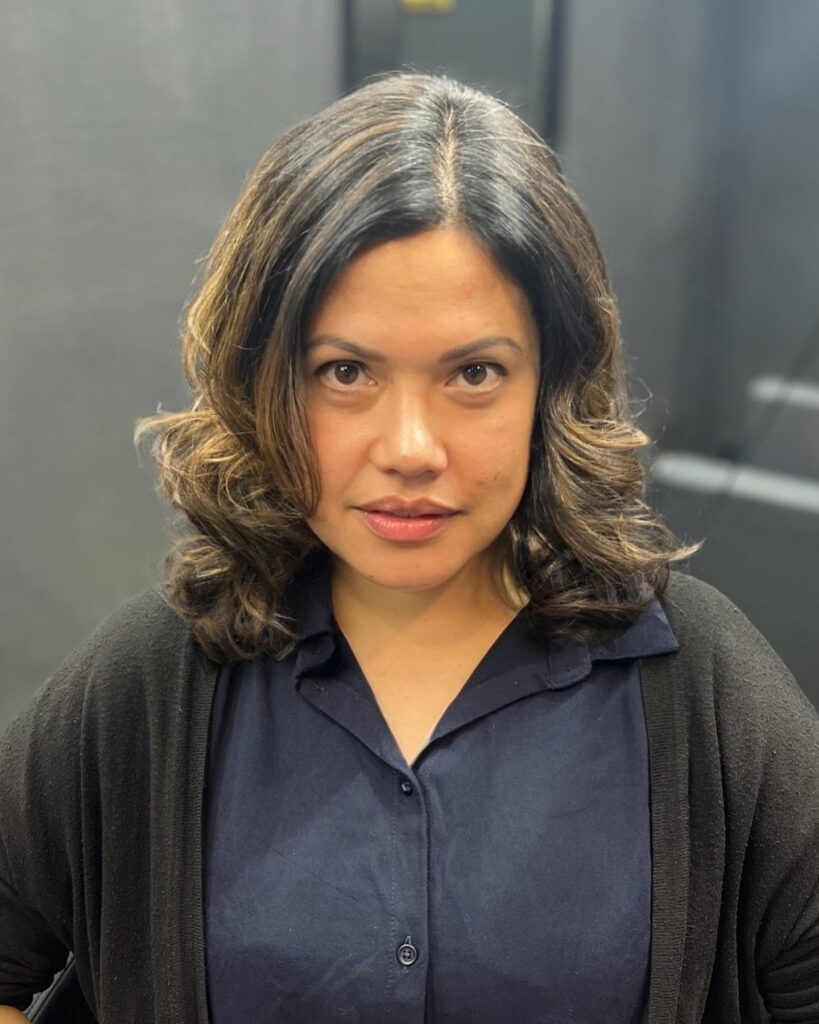 Shoulder length layered brunette hair with soft volume and a rounded shape.