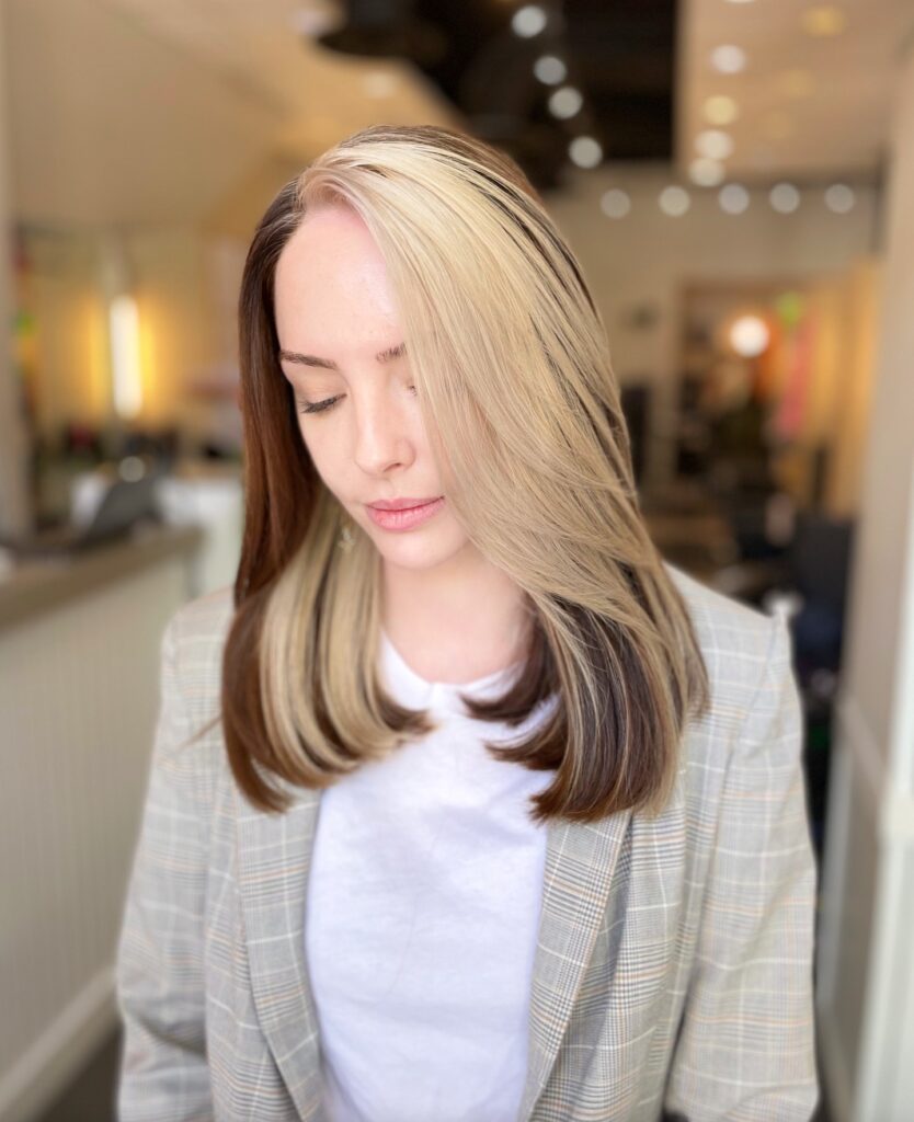 Straight shoulder length lob with subtle layers and a smooth sleek finish.
