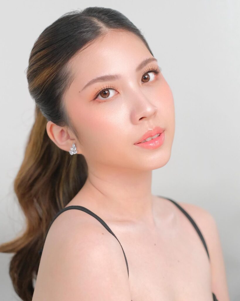 Long hair styled into a sleek low ponytail with smooth top and soft length.