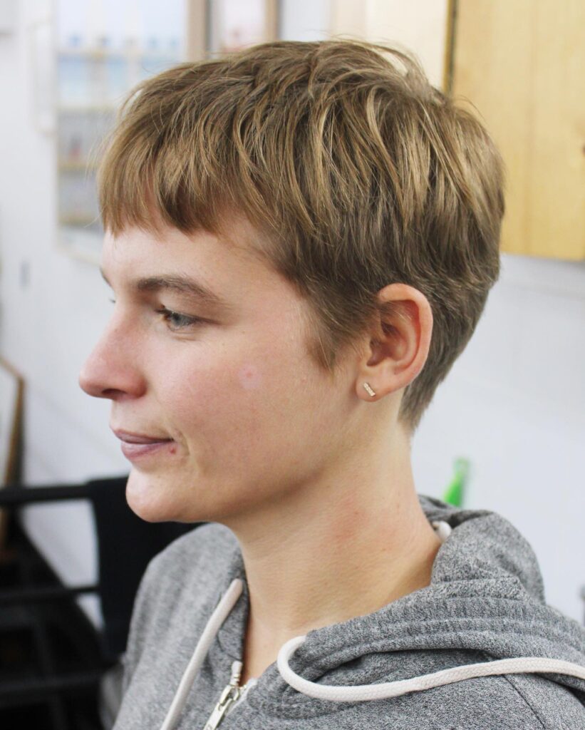 Classic short tomboy pixie with clean lines and natural soft texture