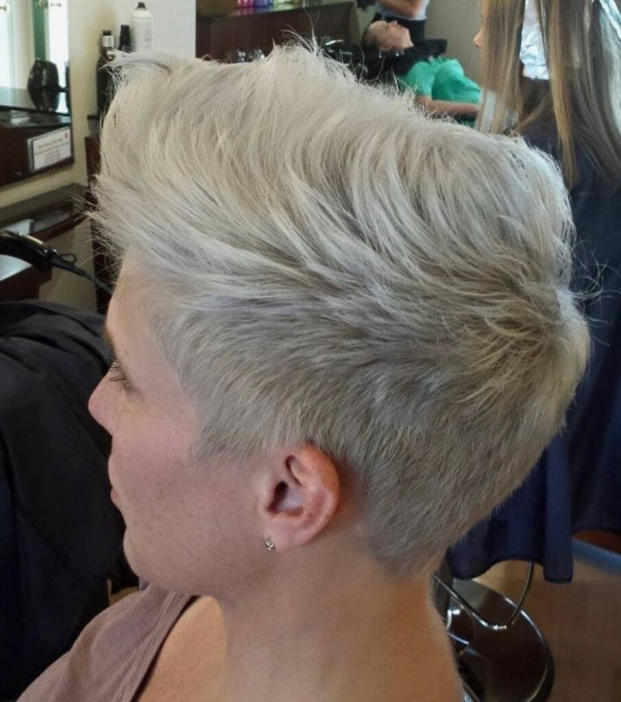 Short silver blonde tomboy crop with soft layers and natural volume on top.