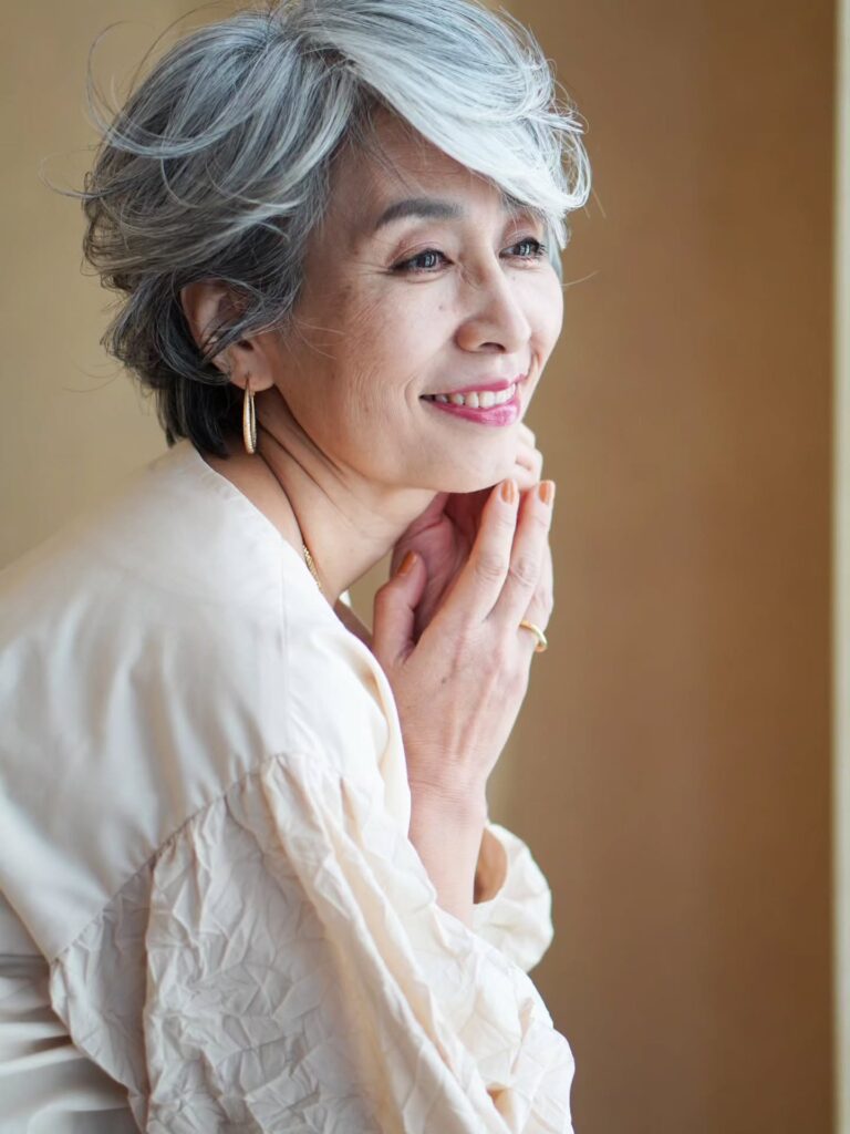 Layered silver bob with wispy fringe and soft rounded shape.