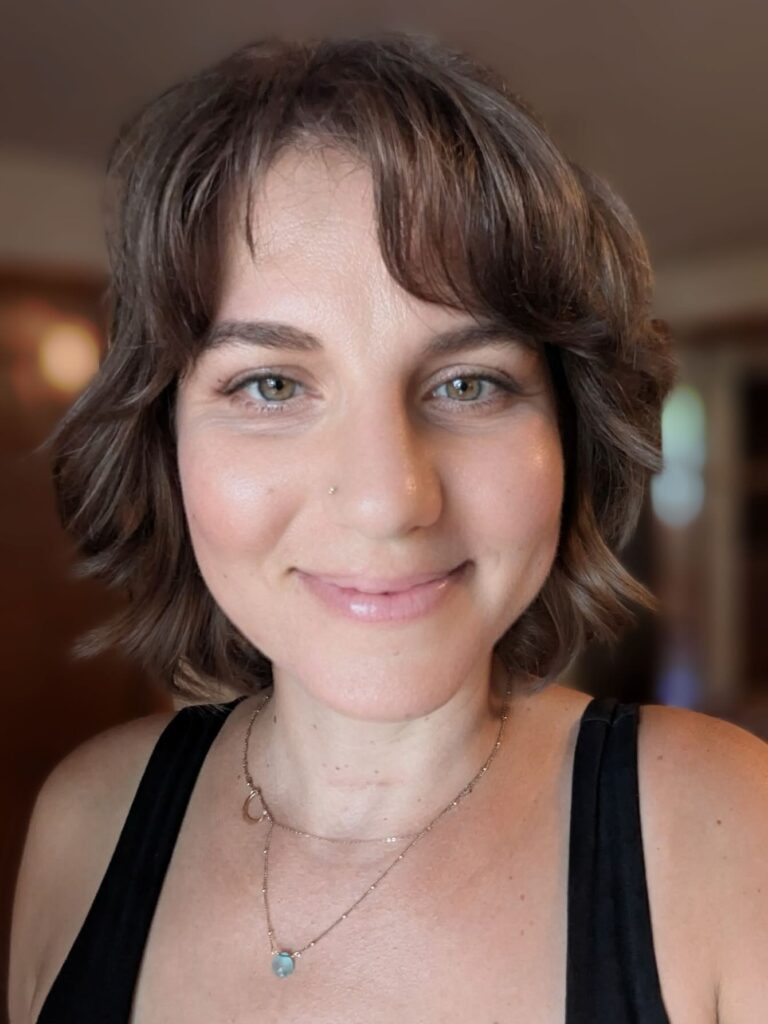 A rounded bob with soft texture and curtain bangs framing the face.