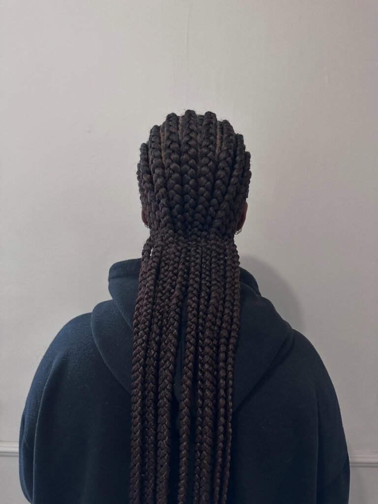 Long straight back cornrows with evenly spaced braids and a natural finish.