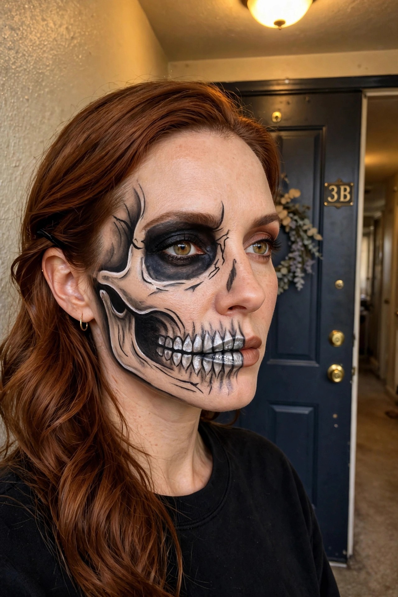 Close up of a woman wearing half skull face paint with black eye socket, white teeth, and crack details on the left side of her face.
