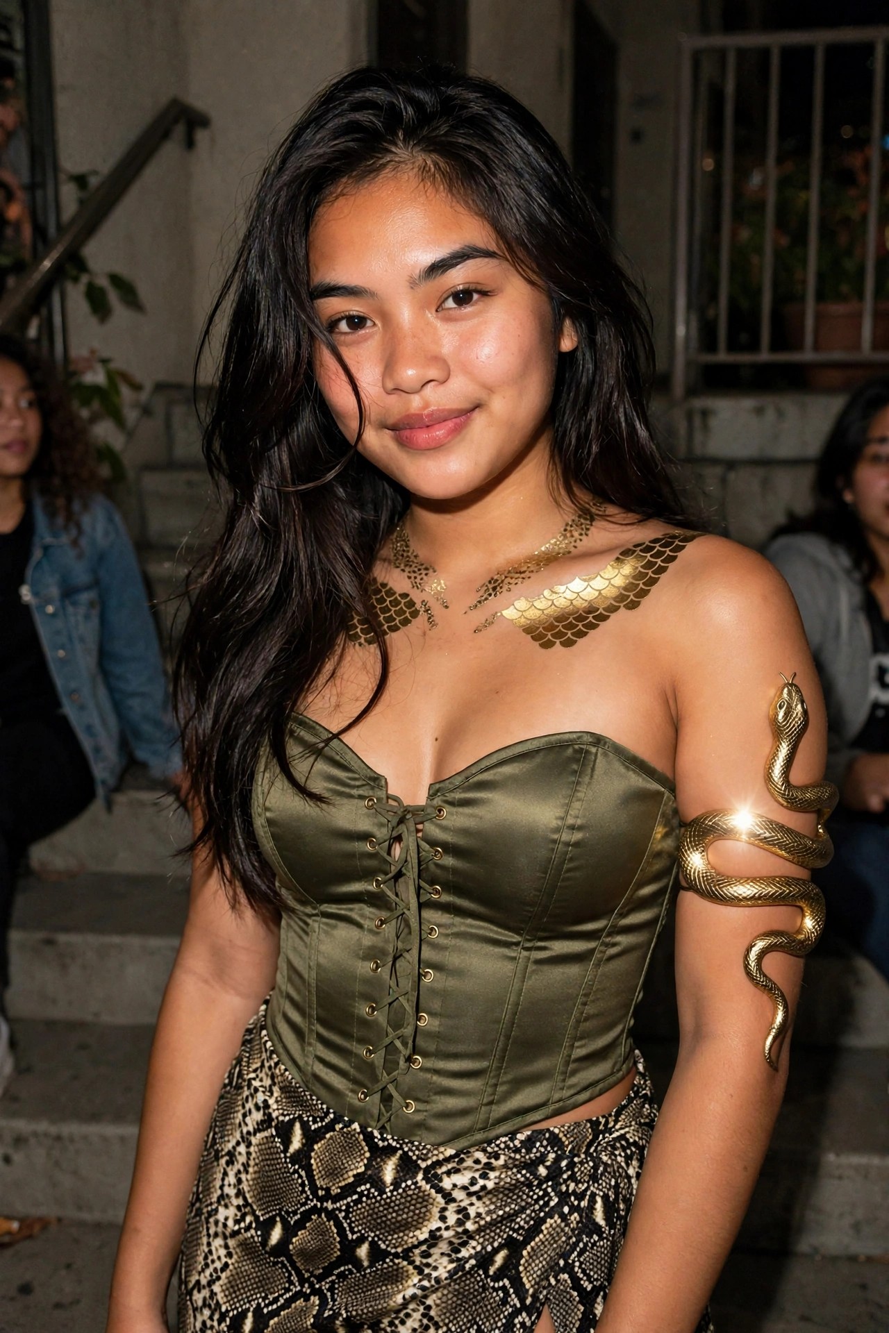 Woman wearing an olive green corset top with gold scale-shaped chest pieces, a golden snake wrapped around her upper arm, and a snakeskin-patterned skirt.